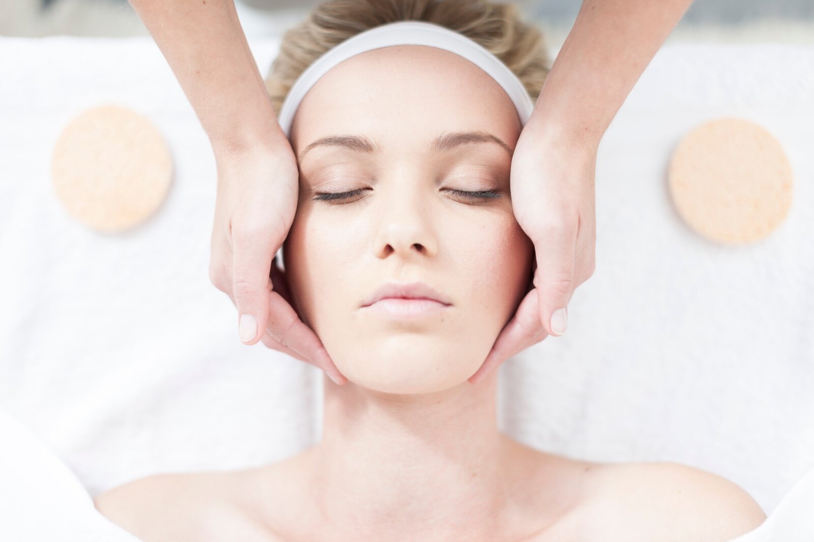 Cosmetician giving facial massage