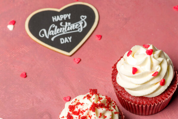 Valentine’s day sweets. Red velvet cupcakes. Tasty cupcake with hearts